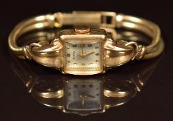 Gelda 9ct gold ladies wristwatch with gold hands and Arabic numerals, silver dial and 15 jewel