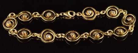 An 18ct gold bracelet made up of eleven spiral links, each set with a diamond of approximately 0.