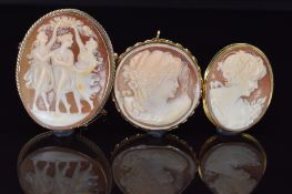 Two 9ct gold brooches and an 18ct gold brooch / pendant, all set with cameos