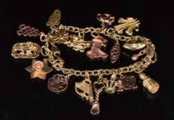 A 9ct gold charm bracelet with nineteen 9ct gold charms, eight being Clogau charms including a