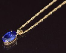 An 18ct gold pendant set with an oval cut tanzanite of approximately 3.3ct on 18ct gold chain, 8.1g,