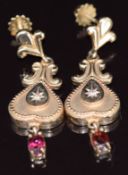 A pair of 9ct gold earrings each set with a diamond and garnets in a heart design, 8.5g