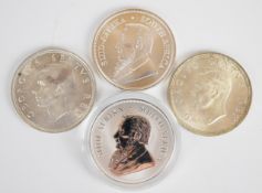 Four South African crown sized coins including 2017 and 2021 silver Krugerrands and 1948 and 1952