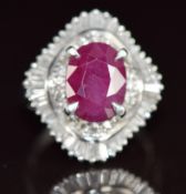 A platinum ring set with an oval cut ruby of approximately 4ct surrounded by baguette and round