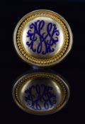 Victorian yellow metal brooch set with blue enamel, verso a locket compartment set with hair, 11.5g,