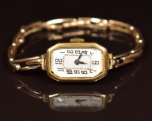 Bravingtons Art Deco 9ct gold ladies wristwatch with blued hands, Arabic numerals, silver dial and