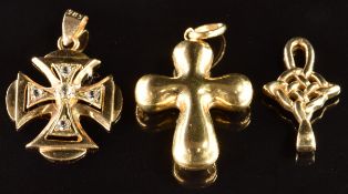 Three 9ct gold pendants in the form of crosses, 5.4g
