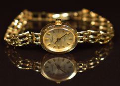 Geneve 9ct gold ladies wristwatch with gold hands, baton hour markers and dial and quartz