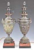 Pair of bronze and marble table lamps formed as classical style urns with mask handles, height 54cm