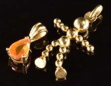 An 18k gold pendant made up of spheres in the form of a stick man by Uno A Erre (2.4g, 2.6cm), and