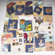 Twelve wartime related commemorative £2 presentation packs, together with a collection of sixteen