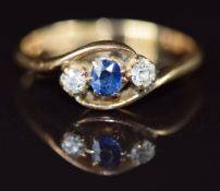 An 18ct gold ring set with a sapphire and diamonds in a twist setting, Birmingham 1901, 2.9g, size