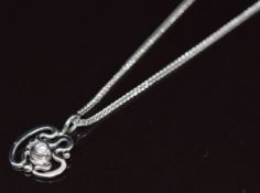A platinum pendant set with a diamond of approximately 0.08ct (1.4cm) on a platinum chain, 3.9g,