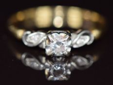 An 18ct gold ring set with a diamond of approximately 0.18ct in a platinum setting, 2.9g, size T