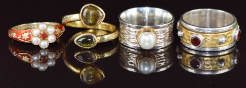 Four silver rings two set with pearls, one with garnets and one quartz