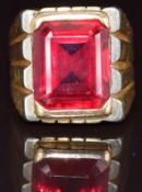 A 14k gold ring set with an emerald cut synthetic ruby, 20.6g, size P