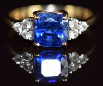 A 9k gold ring set with a cushion cut Tibetan kyanite of approximately 2ct and white sapphires, 2.