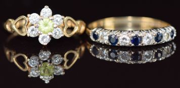 Two 9ct gold rings, one set with sapphires and cubic zirconia and the other peridot and cubic