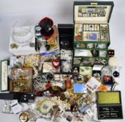 A large collection of costume jewellery including silver pendants, Swarovski bells, vintage