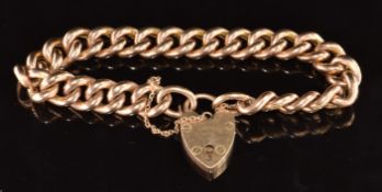 A 9ct rose gold curb link bracelet with engraved decoration and heart padlock clasp, 22.1g, 18cm