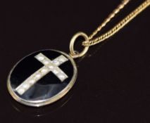 Victorian mourning locket set with black enamel and split pearls in a cross verso a glass