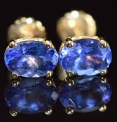 A pair of 18k gold earrings each set with oval cut tanzanite of approximately 0.6ct, 1.9g