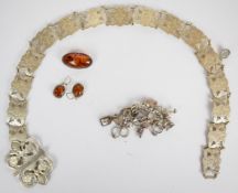 Silver charm bracelet, silver earrings and brooch set with pressed amber and an EPNS belt