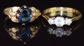 An 18ct gold ring set with three white sapphires and a 14k gold ring set with paste , 5.3g, sizes