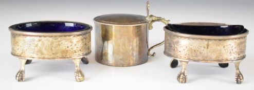 Two Georgian hallmarked silver open salts raised on ball and claw feet, with associated blue glass