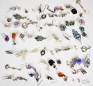 A collection of silver/ white metal earrings including amethyst, garnet, enamel, amber, etc, 130g