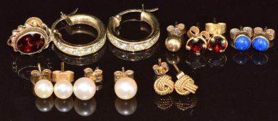 Six pairs of 9ct gold earrings including pearls, knots, hoops, etc and two single 9ct gold earrings,