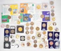 A collection of crown sized commemorative coins, £5 examples etc, some in presentation packs