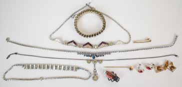A collection of Art Deco jewellery including Empire bracelet, diamanté necklace, insect brooch,
