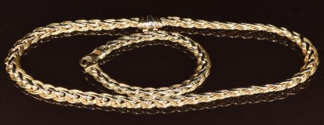 A 14k bi-coloured gold necklace and matching bracelet in a plaited design, 42.9g, 43 & 19.5cm