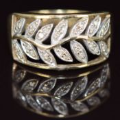 A 9k gold ring set with diamonds in a foliate design, 4g, size R/S