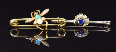 Two Edwardian 15ct gold brooches, one a crescent set with a sapphire and seed pearls and the other