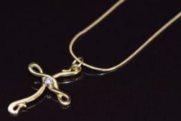 An 18ct gold cross pendant set with a diamond (2.7cm) on 18ct gold chain, 4.7g, 46cm