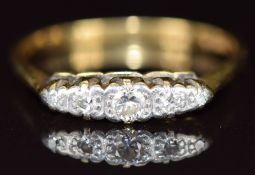 An 18ct gold ring set with five diamonds in a platinum setting, 2.7g, size P
