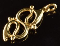 An 18ct gold pendant in an abstract design, 3.7g, 2.6cm