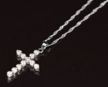 An 18ct white gold cross pendant set with diamonds, on 18ct white gold chain, 2g