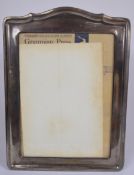 Large George V hallmarked silver photograph frame with oak easel back, Birmingham 1922, maker