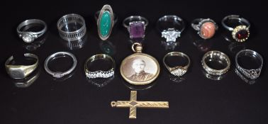 Two 9ct gold rings (4g), a 9ct gold cross (1.6g), a yellow metal and white metal ring marked 10k (