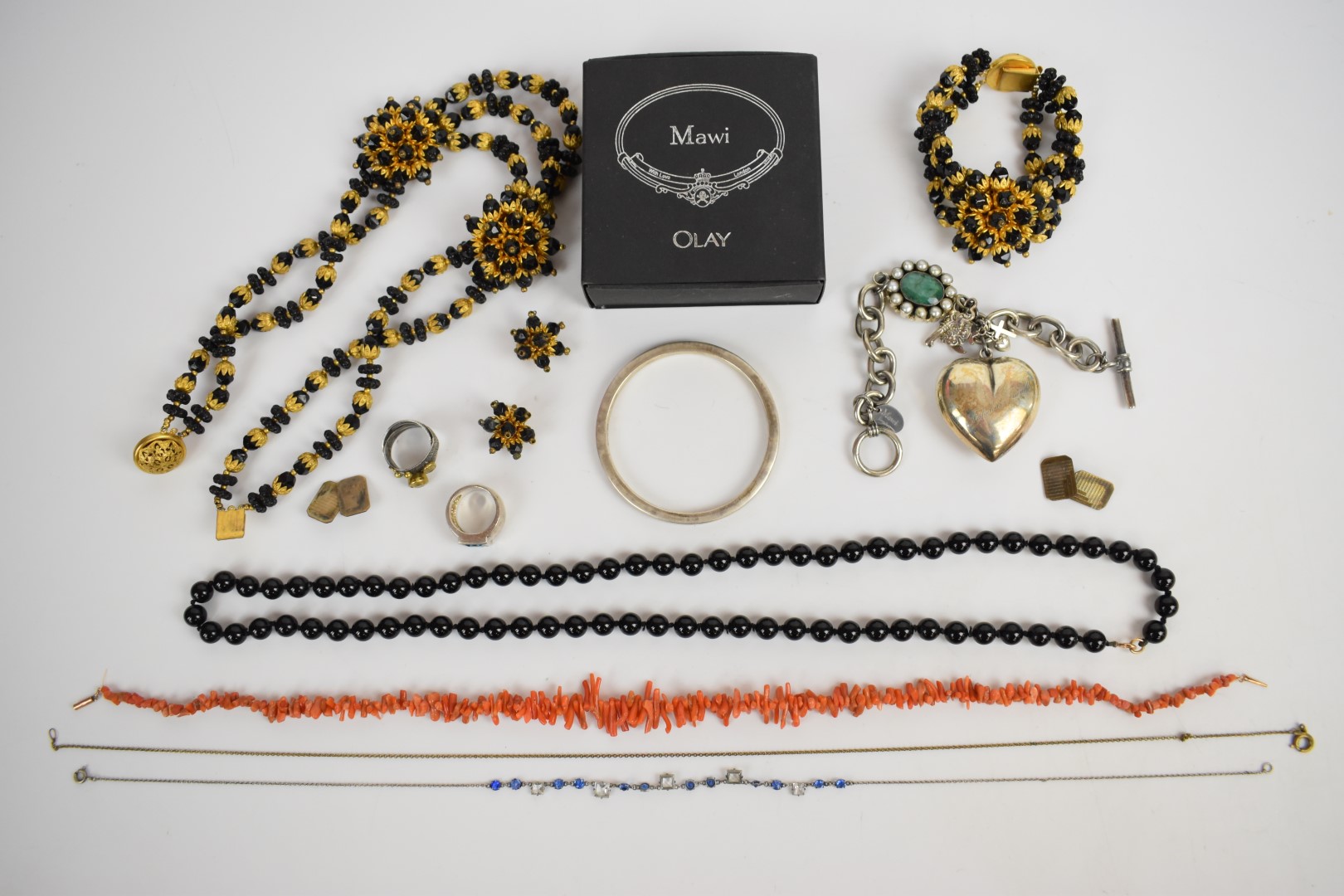 A suite of 1960's costume jewellery comprising earrings, necklace and bracelet, glass necklace