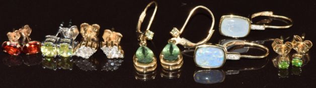 Five pairs of 9k gold earrings including opal triplet, garnet, green diamond, diamonds and a pair of