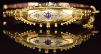A 9ct gold bangle set with an amethyst and two old cut diamonds, Birmingham 1918, 12.2g, 6 x 5.2cm