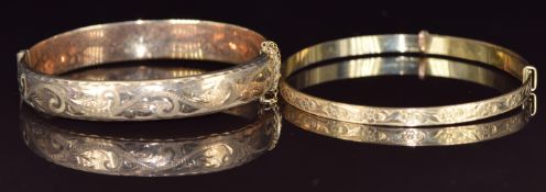 A 9ct gold bangle with engraved decoration (12.5g) and a rolled gold bangle