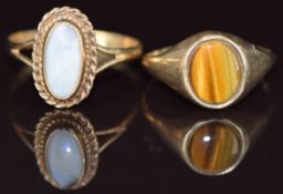 Two 9ct gold rings, one set with tiger's eye and one with opal, 3.3g, sizes l & O