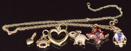 Six 9ct gold pendants including garnet, amethyst, diamond, etc and a 9ct gold chain, 6.7g