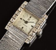 Omega 18ct white gold ladies wristwatch with eight diamonds set to each side of the case, black