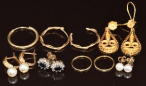 A pair of 14k gold filigree earrings (3g), four pairs of 9ct gold earrings (4.7g) and three single